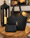 Bolsa tote preta matelassê com nécessaire combinando em cenário elegante