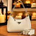 Bolsa mini hobo creme com corrente prateada e alça longa — frente